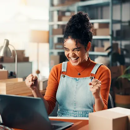 photo-woman-celebrating-at-computer-1×1 photo-woman-celebrating-at-computer-1x1